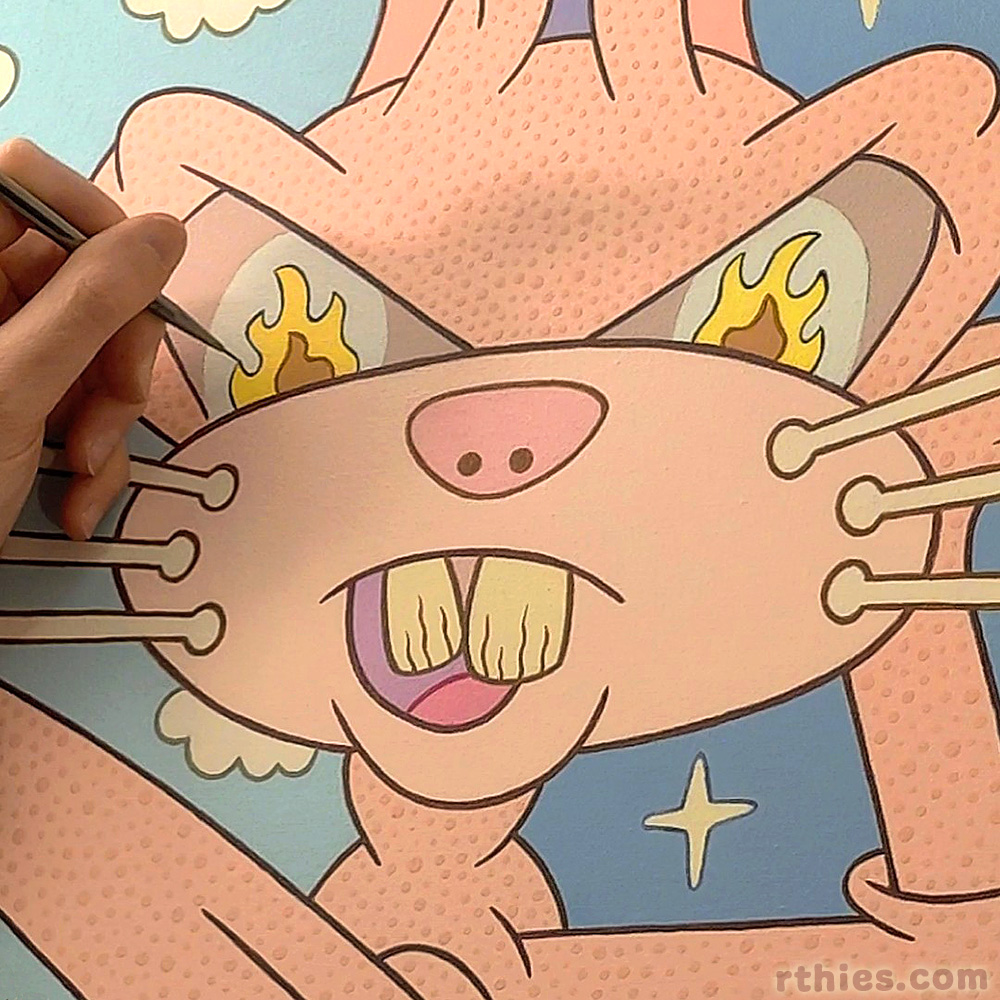 Detail photo of 'Haretic' acrylic painting in progress. Close-up of the contorted cartoon rabbit's face, with flame-styled eyes, and the artist's hand and paintbrush is on the left, included in the photo for scale